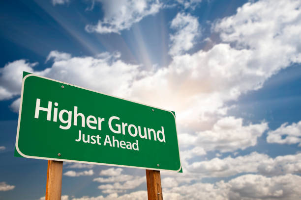 istock Higher Ground Green Road Sign 1005618830