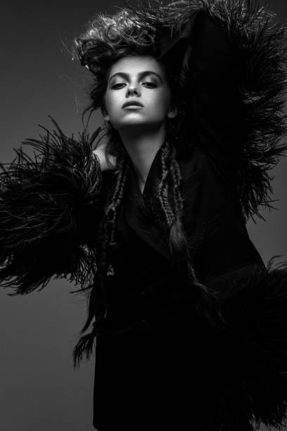 istock Beautiful woman on dark background 1005618862