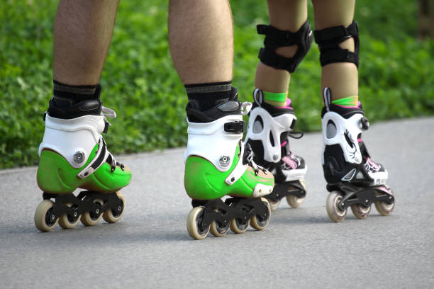 istock two pairs of legs on roller skates 1005618900