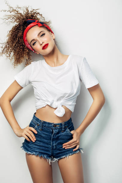 istock Young woman wearing jeans shorts 1005619050