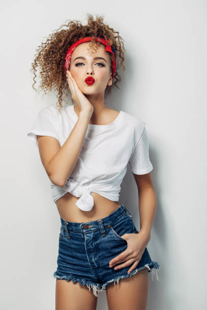 istock Young woman wearing jeans shorts 1005619198