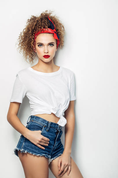 istock Young woman wearing jeans shorts 1005619226