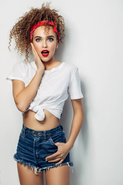 istock Young woman wearing jeans shorts 1005619292