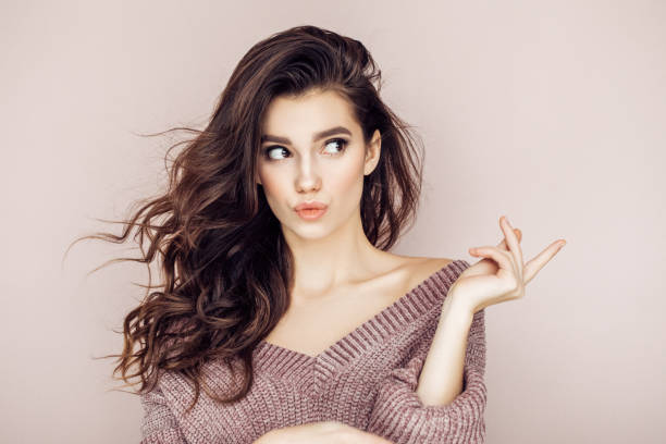 istock Young woman is pointing on something 1005619392