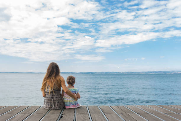 istock Mother and daughter at a pier 1005627378