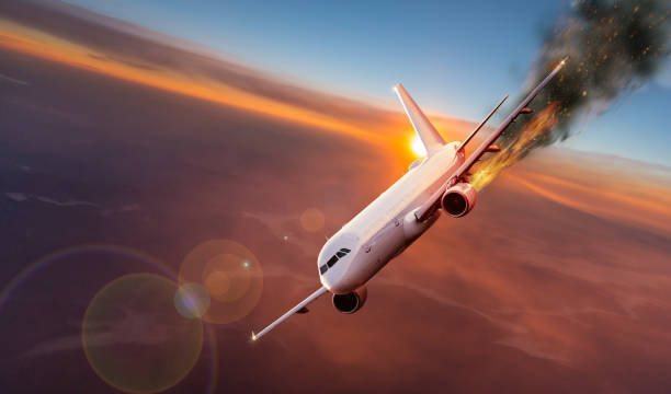 Airplane with engine on fire, concept of aerial disaster Commercial airplane with engine on fire, concept of aerial disaster. airplane crash stock pictures, royalty-free photos & images