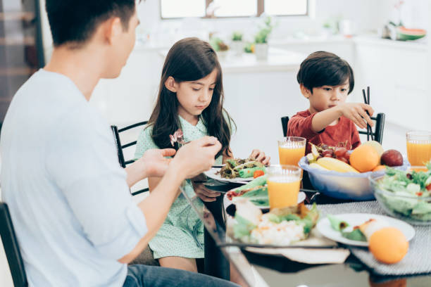 istock Family enjoys Healthy meal 1005631206