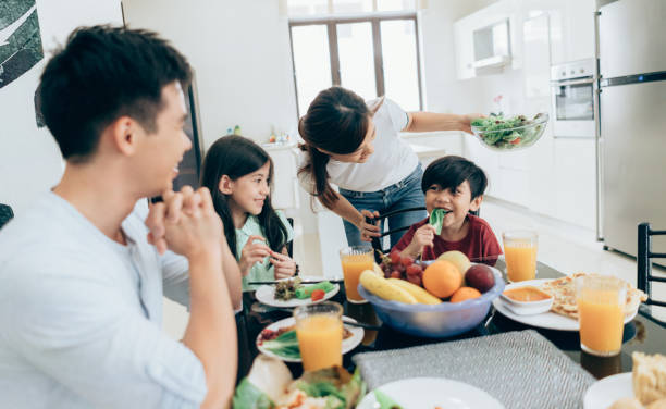 istock Happy Asian ethnicity family at the table 1005631220
