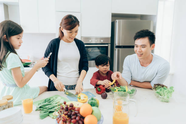 istock Happy family cooking together 1005631222