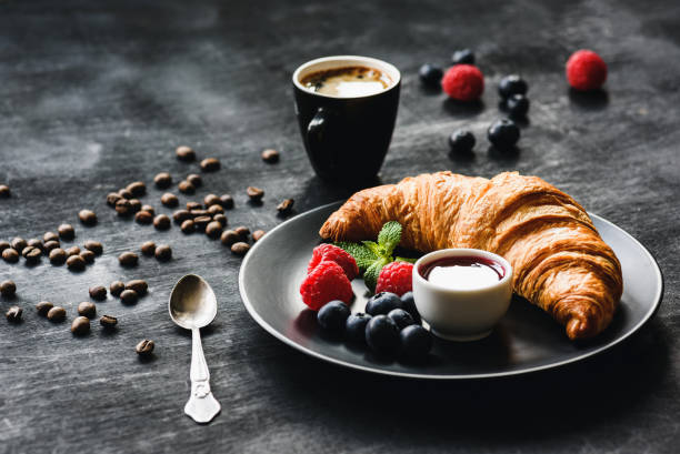 istock Fresh Croissant Berries and Coffee Cup 1005633914