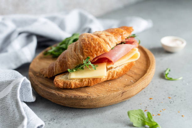 istock Sandwich with ham and cheese on croissant bun 1005633916