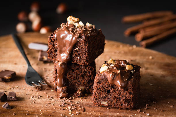 istock Chocolate Cake Brownie Squares With Chocolate Glaze and Walnuts 1005633976