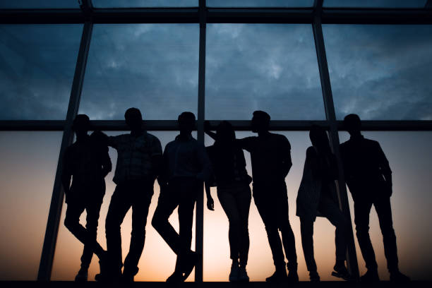 istock creative business team standing near the office window 1005636338