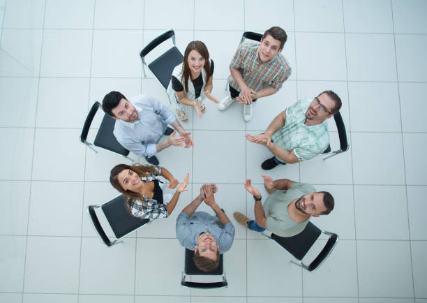 istock top view.boss and business team applauds before the briefing 1005636918