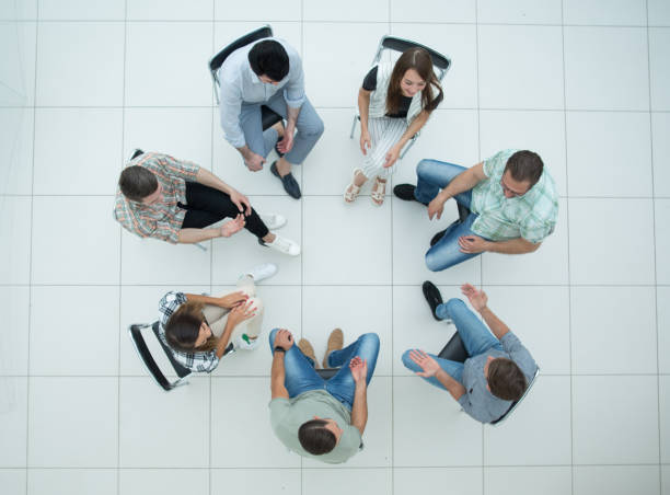 istock top view.boss and business team pointing at you 1005636960