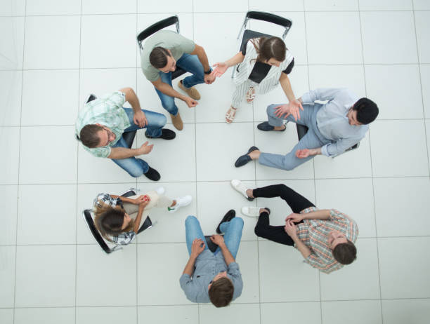istock top view. a team of successful young employees 1005637086