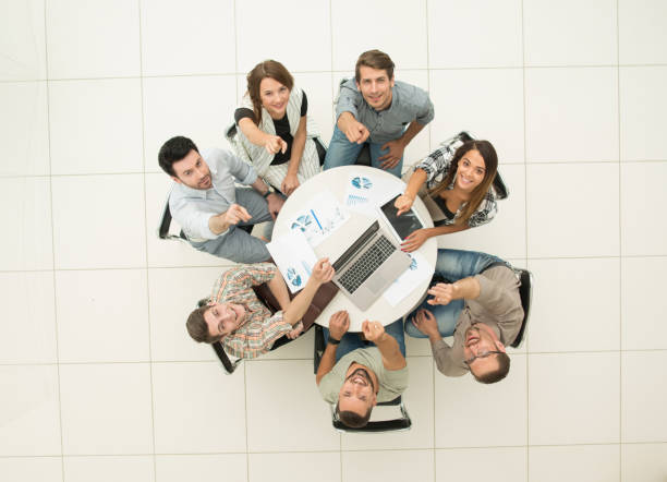 istock top view.successful business team sitting at the round table 1005641282