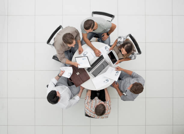 istock top view.business team making a financial report 1005641610