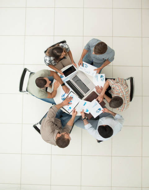 istock top view.business team discussing financial issues 1005641738