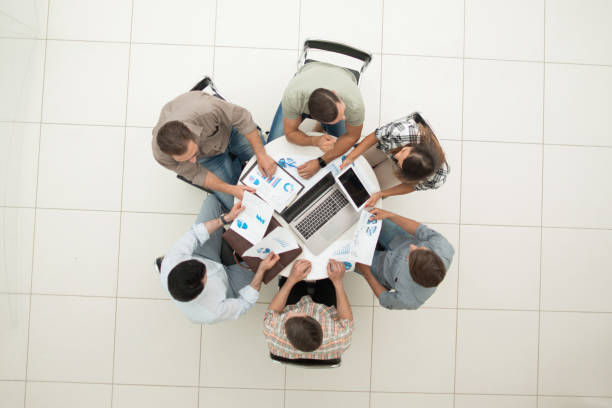 istock top view.business team discussing financial issues 1005641790