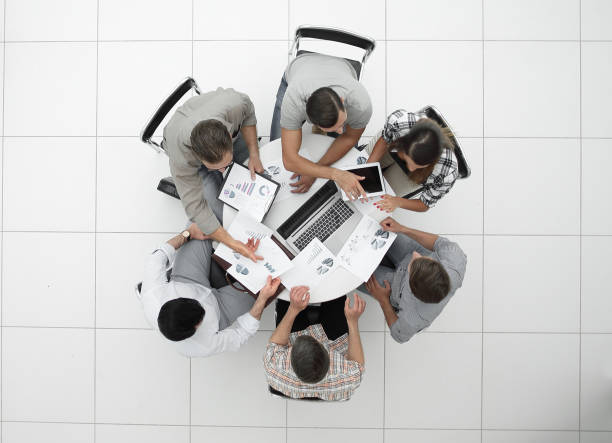 istock top view.the business team holds a round table 1005644010