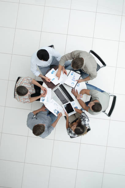 istock top view.business team discussing financial documents 1005644032