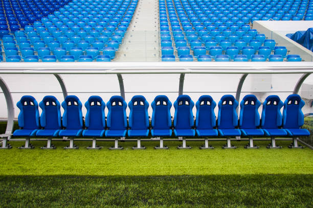 Blue bench or seat or chair of staff coach in the stadium of football View of blue bench or seat or chair of staff coach in the stadium of football bench stock pictures, royalty-free photos & images