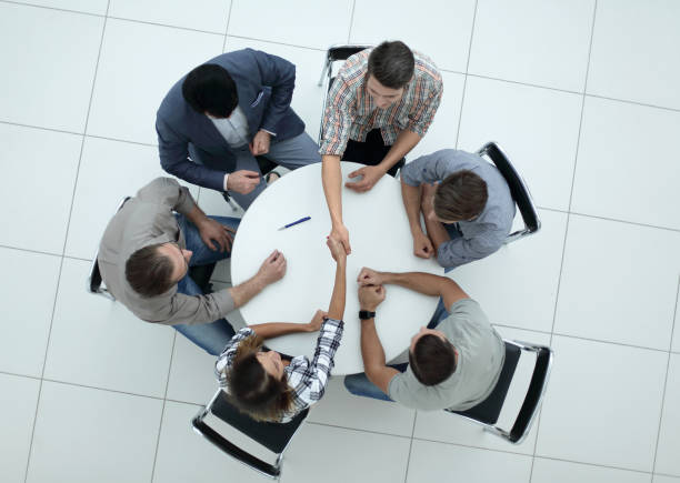 istock top view.creative business group sitting at the round table 1005644290
