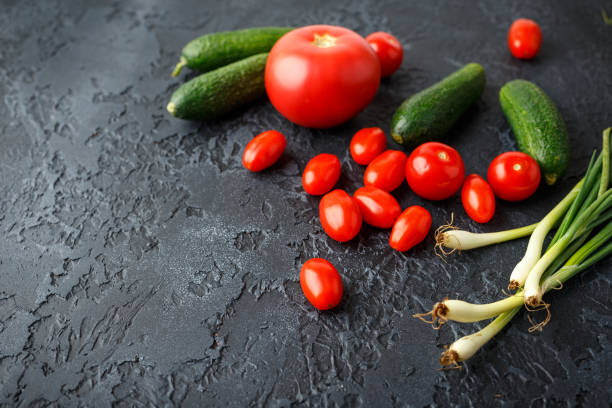 istock Fresh tomatoes, cucumbers and green onions 1005652128