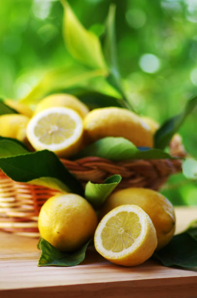 istock Fresh ripe lemons in basket on table 1005682912