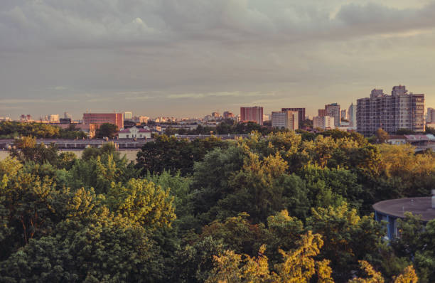 istock Architecture and park Minsk Belarus city and sky at sunset, view from the window 1005689132
