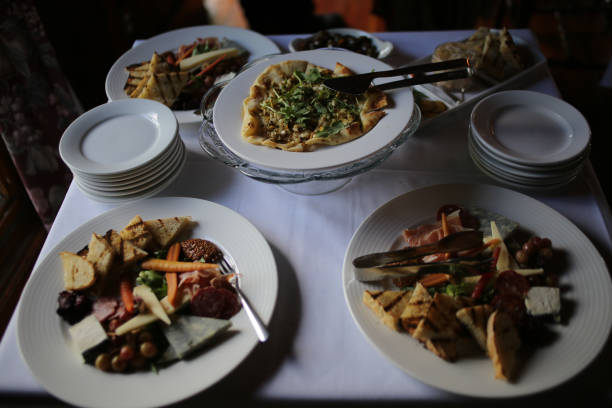 istock Minimalist Delicious Appetizers Catering for Wedding with Pesto Pizza and Vegetables 1005697774
