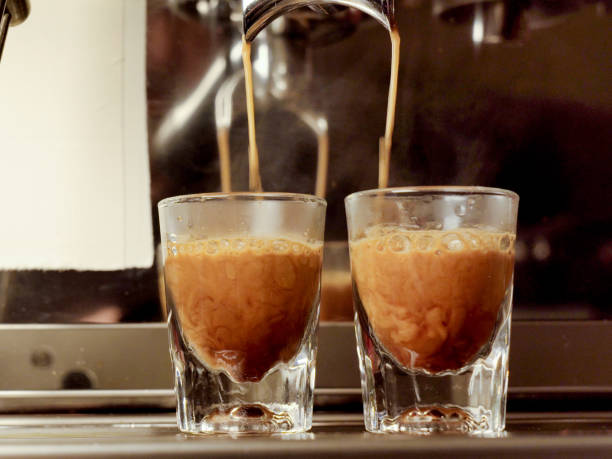 Espresso Shots Being Pulled at a Barista Machine