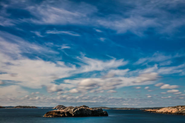 Swedish archipelago under a bright summer sky, dramatic cloud scape