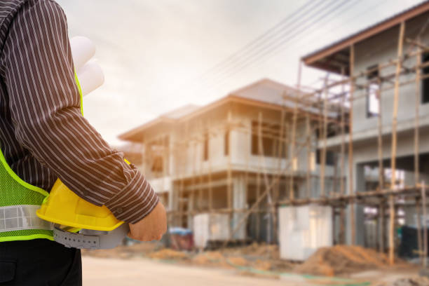 istock Asian business man construction engineer worker at house building site 1005715180