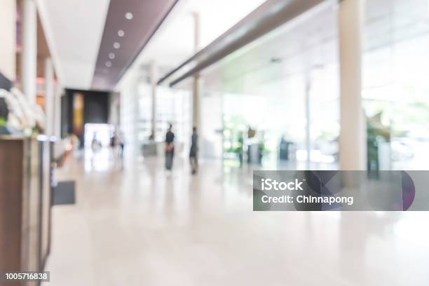 Hotel Or Office Building Lobby Blur Background Interior View Toward Reception Hall Modern Luxury White Room Space With Blurry Corridor And Building Glass Wall Window Stock Photo - Download Image Now