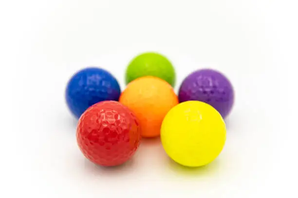 multicolor golf balls on white background