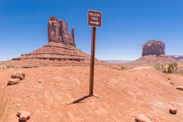 Hiking Monument Valley Trail sign for Wildcat Trail in Monument Valley. merrick butte photos stock pictures, royalty-free photos & images