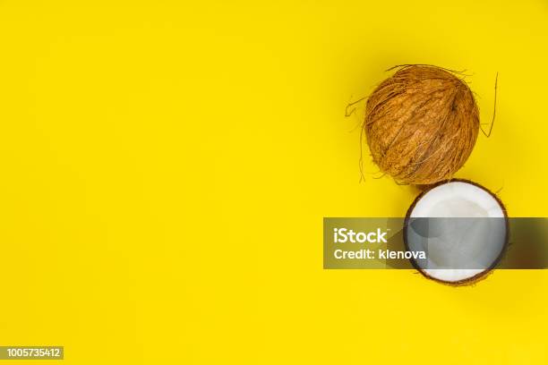 Coconuts On Yellow Background Stock Photo - Download Image Now - Coconut, Abstract, Belgium