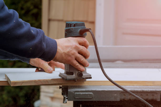 istock Processing carpenter with Electronic Plunge Router of wooden boards hand cutter close-up 1005766028