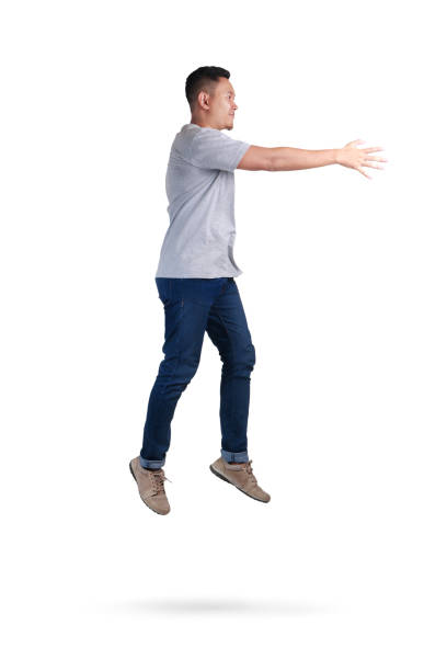 istock Levitation. Young Man Walking Jumping on Air 1005788530