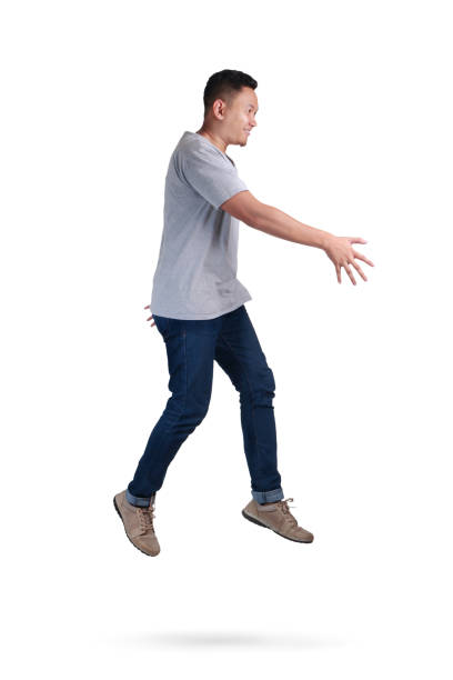 istock Levitation. Young Man Walking Jumping on Air 1005790804