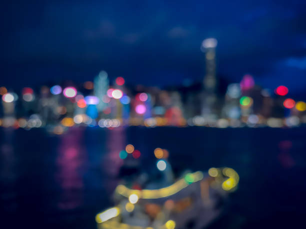 istock Blur image of Hong Kong night view with circle bokeh 1005793458