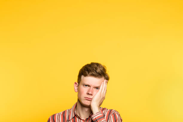 istock bored weariful indifferent unenthusiastic man 1005793574