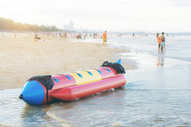 istock Banana boat on sand beach. 1005805710
