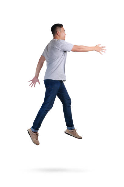 istock Levitation. Young Man Walking Jumping on Air 1005805942