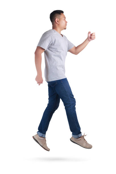istock Levitation. Young Asian man jumping dancing walking 1005806224