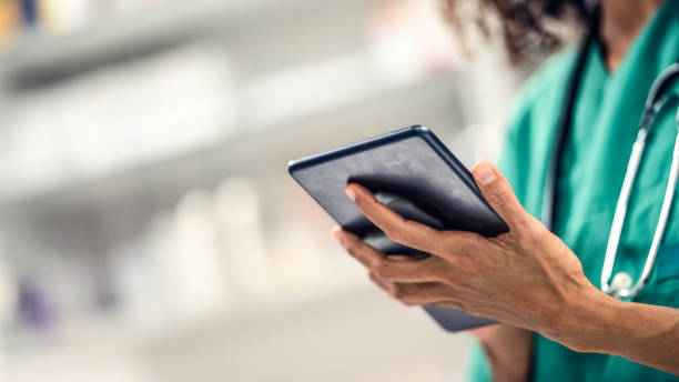 istock Close-up of doctor using digital tablet 1005815236