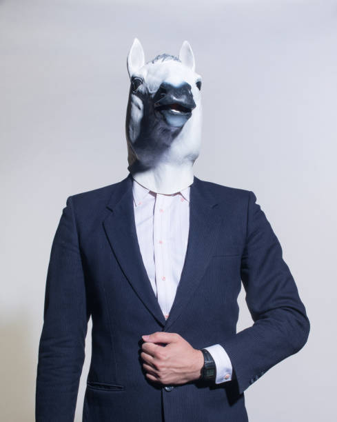 istock man with a horse mask on a light background 1005829980
