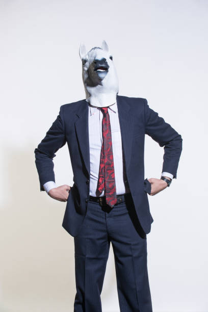 istock man with a horse mask on a light background 1005830592